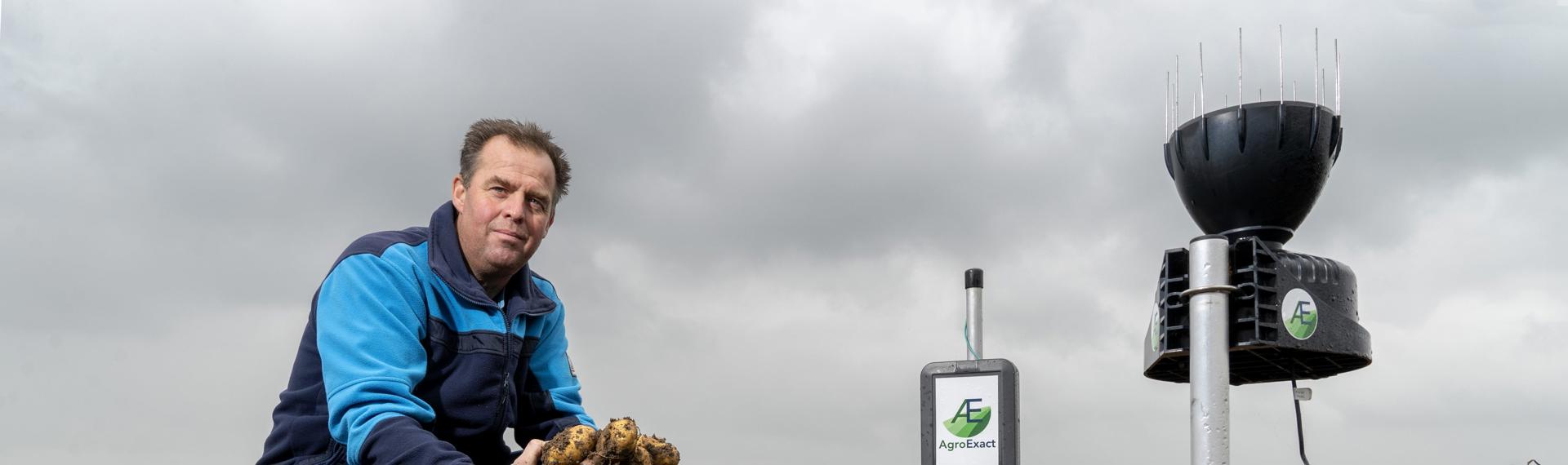 Farmer Jan Straver with the weather station of AgroExact